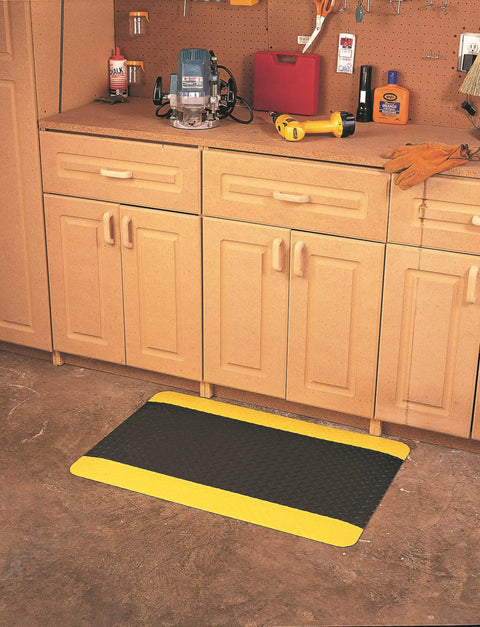 Diamond Plate Select UltraSoft Anti Fatigue Floor Mat 4 Ft By 2 Ft 15 16th Inch Thick Black With Yellow Edge in workshop.