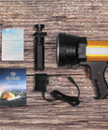 Rechargeable Spotlight Beast With 2,000,000 Lumens Handheld Large Flashlight and accessories on wooden surface