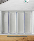 Top view of Clear Drawer Organizer Set Four Piece Modular Bins For Office Home Makeup Kitchen And Junk Drawer Storage Crystal Clear Plastic Durable And Stackable For Easy Access Boss Level Neat Drawers inside a drawer.
