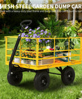 Beast 1400 Pound Garden Dump Cart 3 In 1 Yard Wagon with flowers loaded in steel utility trailer on grass