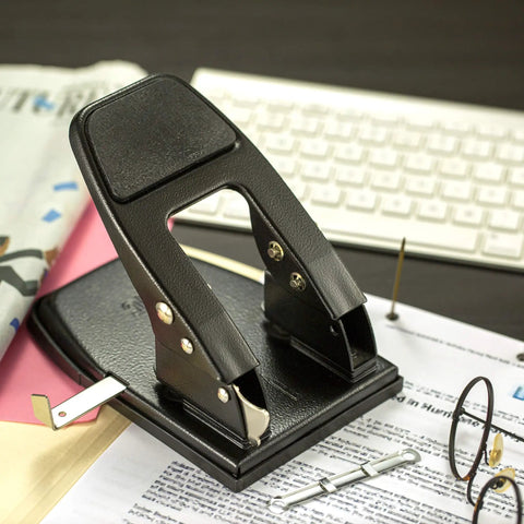 2 Hole Padded Punch For Office Use, Medium Duty, 50 Sheet Capacity, Ergonomic Padded Handles, Adjustable Guide, Black on office desk