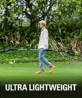 Person carrying 80V 10 Inch Cordless Polesaw For Pruning And Trimming Branches With Brushless Motor And Automatic Oiler Delivers Long Runtime 83 Cuts Per Charge Tool Only Compatible With 75 Plus Tools on grass