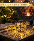 Two Pack Outdoor Solar Hanging Lantern Lights With Handle Waterproof Tabletop LED Moroccan Style Metal Garden Lanterns casting patterns on table.