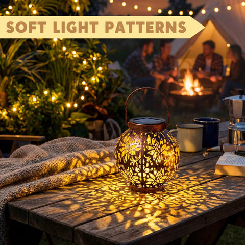 Two Pack Outdoor Solar Hanging Lantern Lights With Handle Waterproof Tabletop LED Moroccan Style Metal Garden Lanterns casting patterns on table.