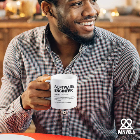 Smiling person holding Engineer Definition Mug A Nerdy Yet Real Talk Engineering Gift For Engineers Graduation Birthday Or Promotion Celebrations Perfect Ceramic Mug 11 Oz White For Coworkers And New Engineers, text visible on mug.