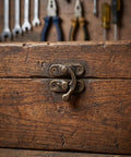 Vintage Swing Arm Latch Set In Antique Brass With Decorative Horn Lock on wooden box
