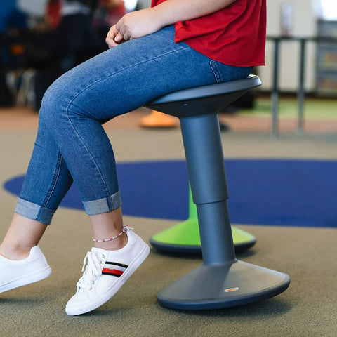 SitWell Wobble Stool With Adjustable Height For Active Seating In Classrooms And Libraries in gray, promoting core strength and posture.