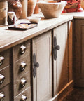 Vintage Cast Iron Drawer Pulls For Wardrobe And Cabinets on rustic kitchen cabinet, featuring antique dresser handles.
