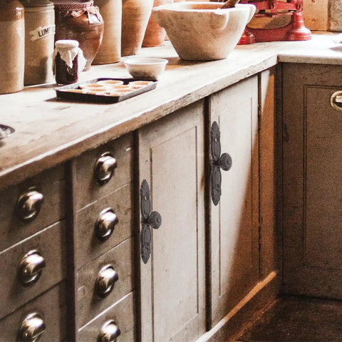 Kitchen with vintage cast iron drawer pulls for furniture renovation and dresser hardware, Nordic style cabinet handles visible