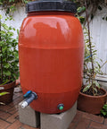 Rain barrel with Three Quarter Inch Drain Valve Plug Kit With Silicone O Ring And Bulkhead Adapter, forest green plug visible.