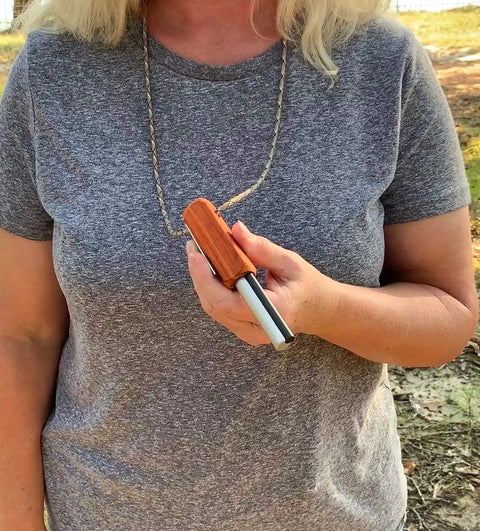 Person holding Compact European Fire Steel Ferro Rod With Magnesium On A Durable Lanyard Trail Ready Go To Emergency Fire Starter.