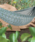 Brazilian Style Mesh Hammock in a Bag 55 Inch Wide Light Blue Palm Tree Travel Hammock outdoors near a tent