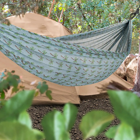 Brazilian Style Mesh Hammock in a Bag 55 Inch Wide Light Blue Palm Tree Travel Hammock outdoors near a tent