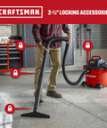 16 Gallon 6.5 Peak HP Wet Dry Shop Vacuum With Built In Blower Port being used in a garage on a wet floor