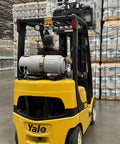 Steel Forklift Propane Tank Cylinder With Built In Gauge, 33.5 Lb Capacity on forklift in warehouse, horizontal mount