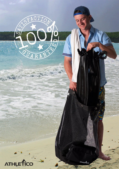 Person holding XL Mesh Travel Scuba Diving Bag For Snorkeling Gear And Equipment on a sunny beach