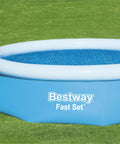 Hella Effective 10 Foot Solar Pool Cover That Locks In Heat And Shields Against Debris over a blue above-ground pool.