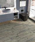 Peel And Stick Waterproof Floor Tiles In Blue Reclaimed Wood Look Vinyl Plank Flooring 6 By 36 Inch Planks in a bathroom.
