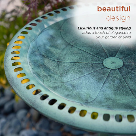 Close-up of pedestal birdbath with scrollwork in aged green for outdoor gardens and patios, showing shallow bowl design.