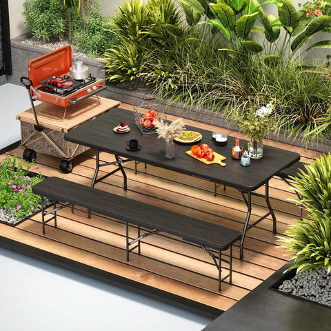Six Foot Folding Picnic Table Set With Two Benches HDPE Wood Pattern Top on patio with food and grill, black