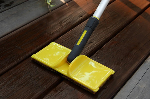 9-Inch Wood Stain Applicator With Pivot Head, Replaceable Tear-Resistant Pad on wood surface