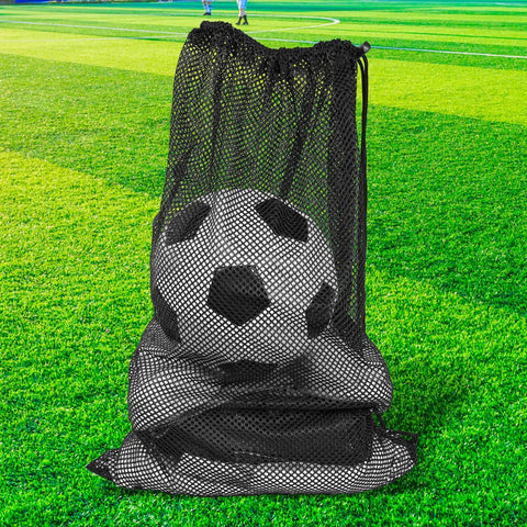 Oversized black mesh gear bag holding a soccer ball on grass, part of the Set Of 2 Oversized Mesh Gear Bags 19 By 27 Inches In Black And Blue.