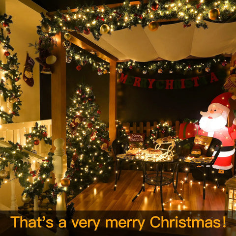 Solar Outdoor String Lights 60Ft 180 LED IP67 Waterproof in a festive Christmas garden setup with Santa decoration.