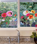64 Pcs Flowers And Butterflies Wall Decals Peel And Stick Removable PVC Garden Murals decorating a window in kitchen decor.