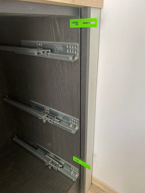 Built Like A Boss 3 Piece Scribe Jig Set To Nail Perfect Cabinet Lines On Toe Kicks Fillers And Panel Gaps For Woodworkers Carpenters And Diy Home Projects With Zero Sweat, showing jig attached to cabinet.