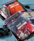 Jumbo 2.5 Gallon Storage Bags with Secure Zip and Click Closure, Writable Label for clothes and shoes in a suitcase.