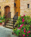 Heavy Duty Wrought Iron Handrails For Outdoor Steps with flowers and stone stairs leading to a wooden door.