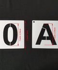 Reusable 2 Inch Letter Stencil Set For Wood Wall Fabric Rock And Signage DIY Art Projects 36 Alphabet And Number Stencils With Binder Ring Durable White Plastic Templates For Craft Lovers showing 'O' and 'A' stencils on black background.