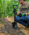 Man using Mini Digging Shovel Built Tough With Heavy Duty Carbon Steel Head And Serrated Blade in a garden