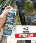 Person using Max Suspension Spray For Bicycles A Premium Lubricant For Forks And Shocks That Revives Old Suspension, 9 Fl Oz, on bike fork