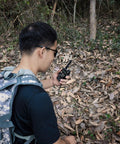 Person using Dual Band Ham Radio Antenna For 136 174 MHz And 400 470 MHz Two And A Half Inch Mini Soft Whip in outdoor area