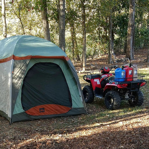 Tent and ATV with portable 5 gallon military style water jug for camping and RVs sand colored