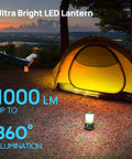 Ultra Bright LED Camping Lantern 1000 Lumens with Four Light Modes illuminating yellow tent and man in hammock at campsite.