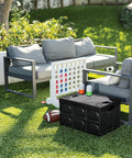 Big Time Heavy Duty Collapsible Storage Bin With 16 Gallon Capacity on grass beside outdoor seating set.