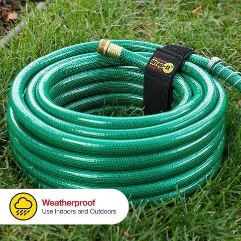 Coiled green hose secured with a Wrap-It strap, part of the Assorted Twelve Pack Elastic Cinch Straps For Cords, Hoses, Ropes And Cables