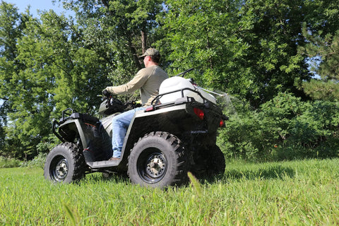 15 Gallon ATV Boomless Broadcast Sprayer With 16 Foot Swath, 2.2 GPM On Demand Diaphragm Pump mounted on ATV in field