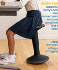 Teen sitting at desk on SitWell Wobble Stool With Adjustable Height For Active Seating In Seafoam, showing posture support.
