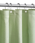 Close-up of sage green cloth shower curtain liner with 2 magnets, textured polyester, hotel quality, 72x84 inch.