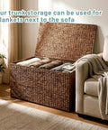 Large Water Hyacinth Wicker Storage Chest With Metal Frame, Beefy Heavy-Duty Trunk With Lid next to sofa in living room