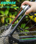 Applying drivetrain cleaning and lubrication essentials kit with bicycle degreaser and lubricant brush tool on bike gears.