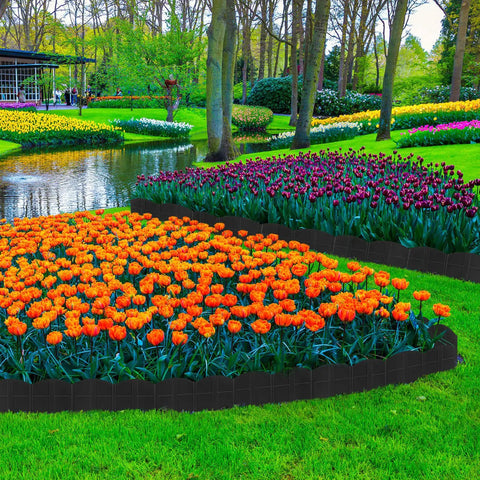 40 Ft No Dig Landscape Edging Kit With 40 Stakes, Flexible Plastic Border shaping flower beds in a garden