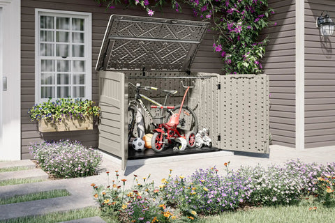 Horizontal Outdoor Storage Shed For Trash Cans And Yard Tools All Weather Resin With Soft Close Lid Wood Like Finish UV Protected Reinforced Floor Holds Two 96 Gallon Cans Made In The USA with open lid showing garden tools and bicycle