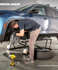 Man using 6000TLX Portable Car Lift Bundle with Pinch Weld Blocks and Wall Hangers ALI Certified 110V to lift SUV for repair