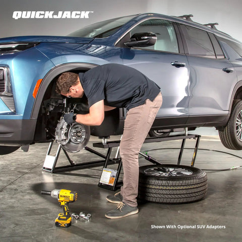 Man using 6000TLX Portable Car Lift Bundle with Pinch Weld Blocks and Wall Hangers ALI Certified 110V to lift SUV for repair