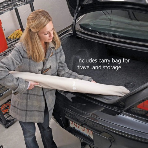 Woman placing Extra Wide Doorways Fabric Baby And Pet Gate Pressure Mounted For Openings 38 To 60 Inches into car trunk