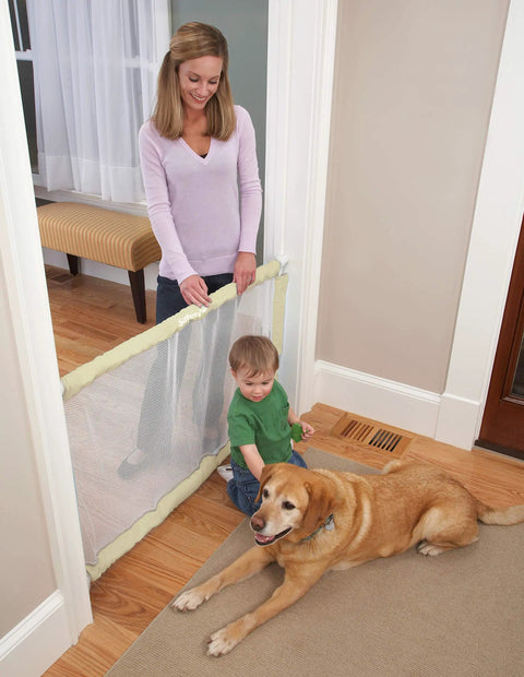 Parent with toddler and dog by Extra Wide Doorways Fabric Baby And Pet Gate Pressure Mounted For Openings 38 To 60 Inches